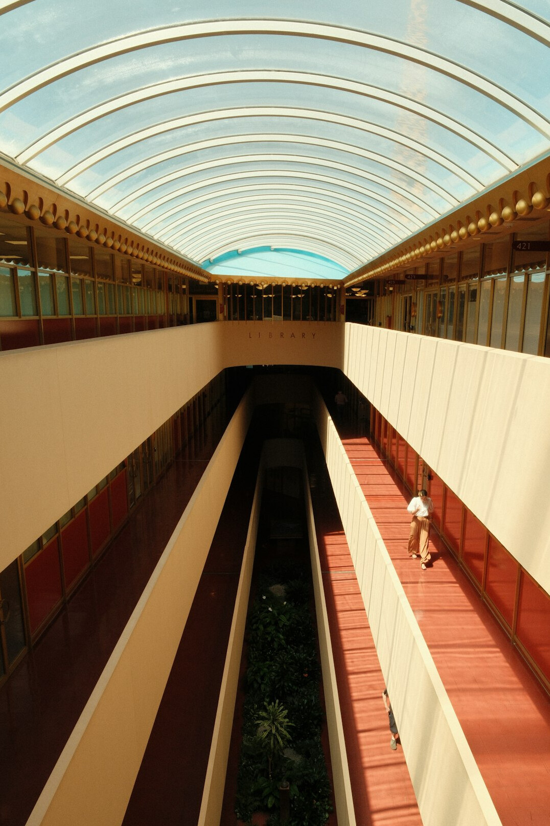 Long library corridor with bookshelves