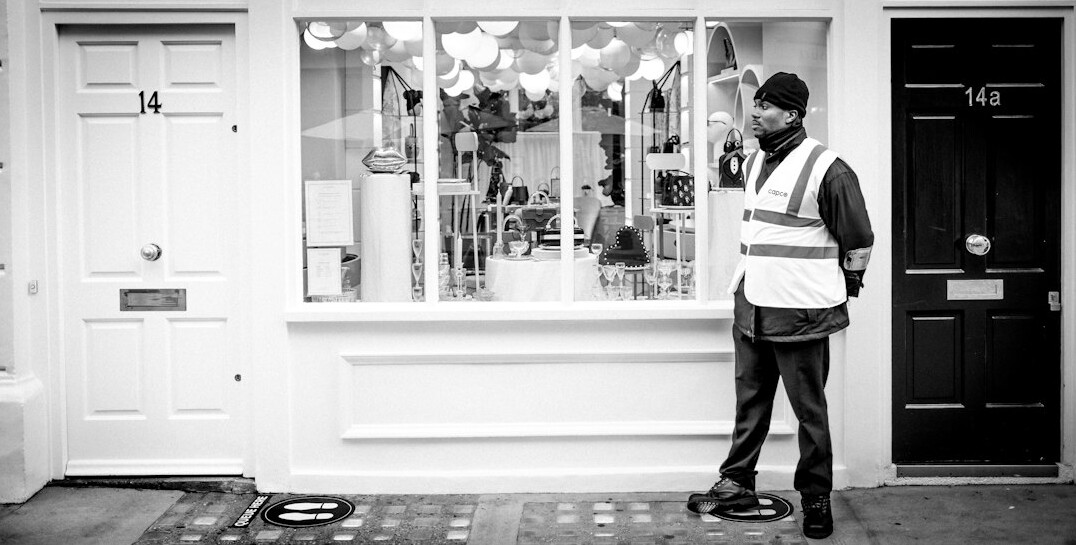 store security guard watching cameras